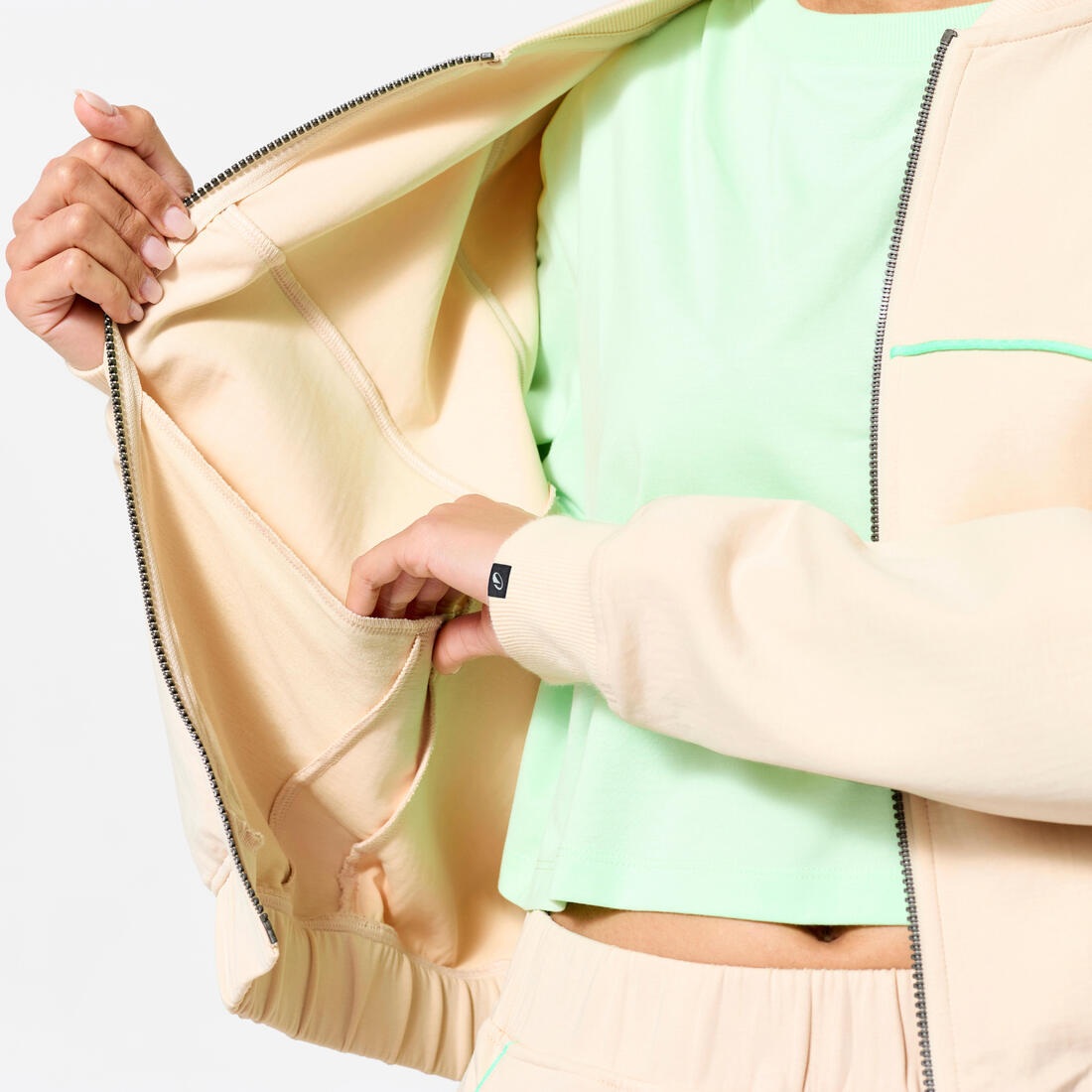 Veste bombers zipée femme, beige avec piping vert.