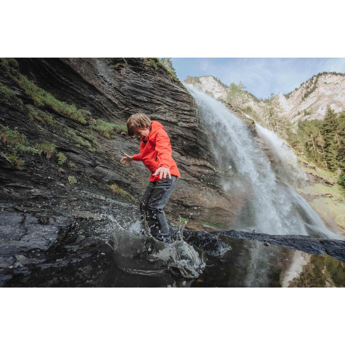 Pantalon de randonnée softshell - mh550 noir - enfant 7-15 ans