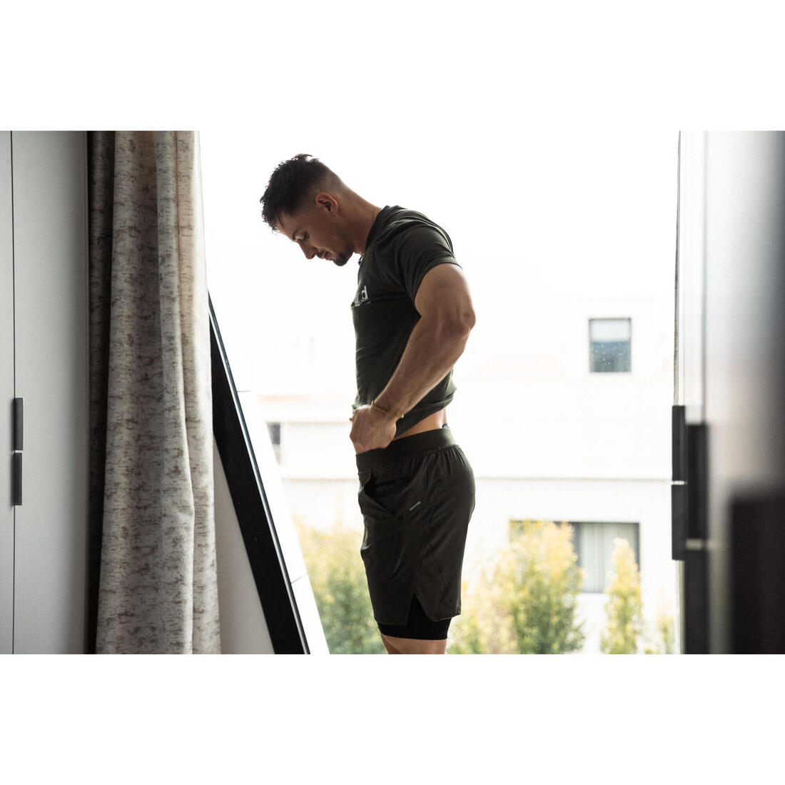 Short de fitness 2 en 1 collection respirant poche zippée homme