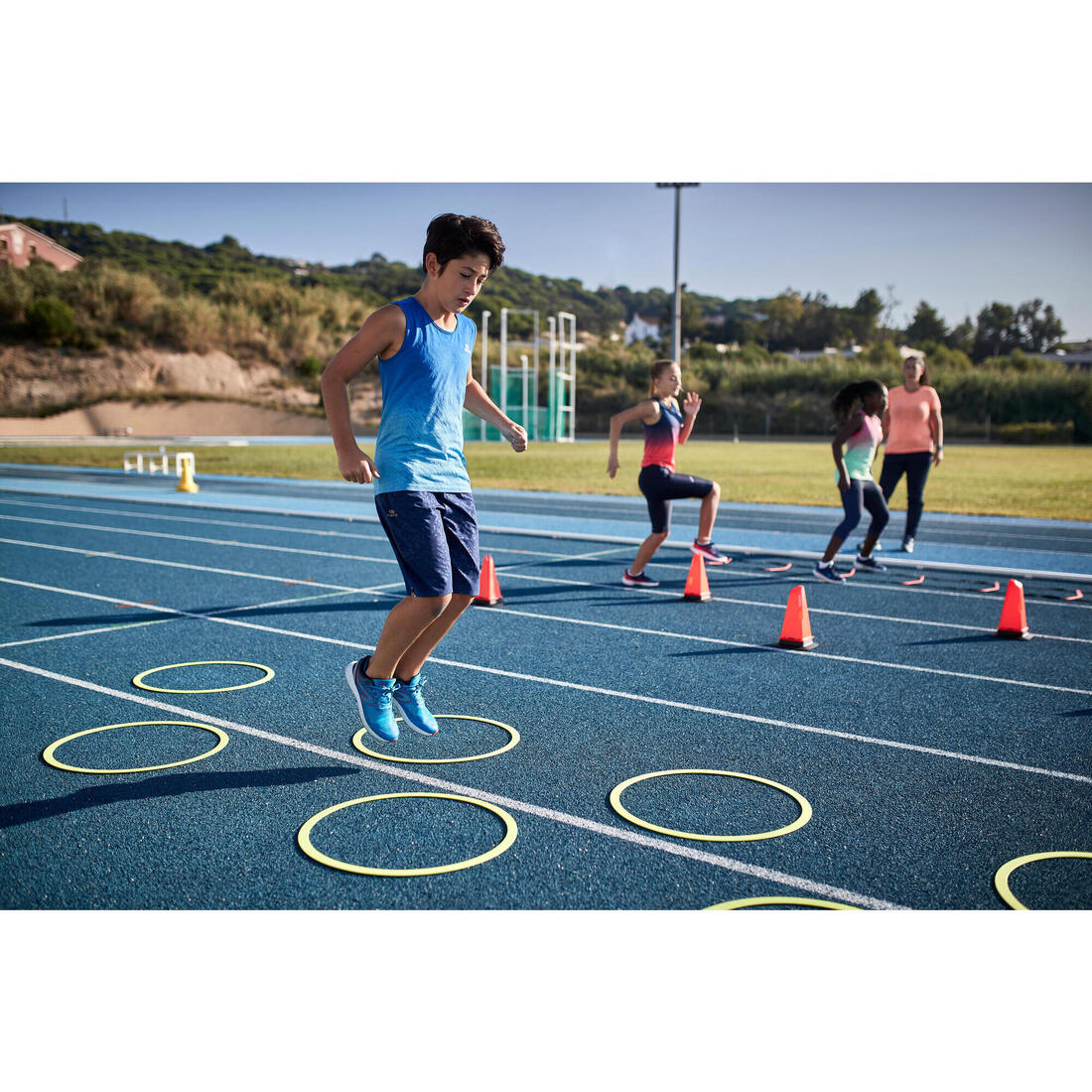 Débardeur running - athlétisme respirant garçon KIPRUN CARE bleu et rouge
