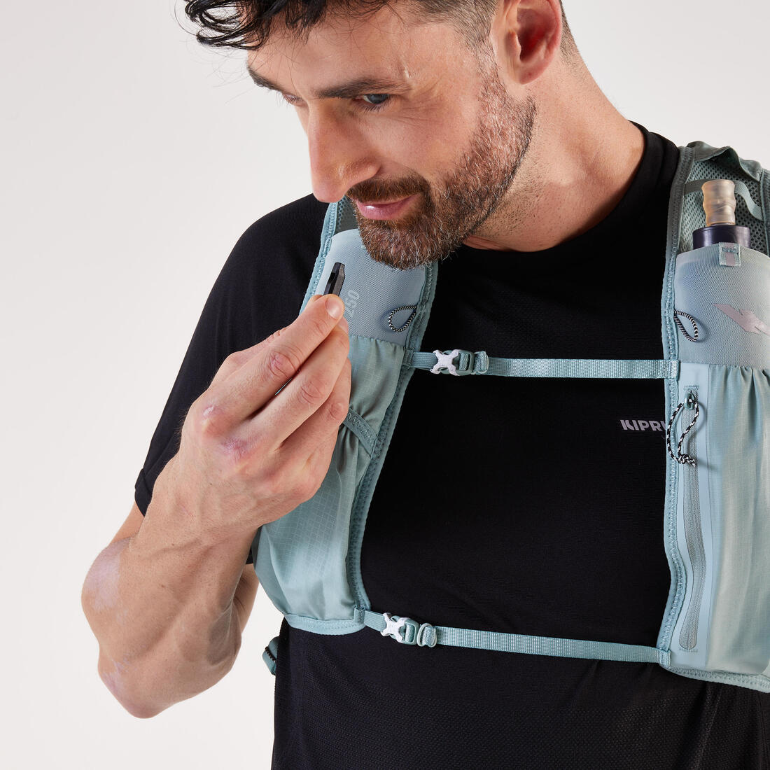 Sac trail running 5l turquoise - vendu avec poche à eau 1l
