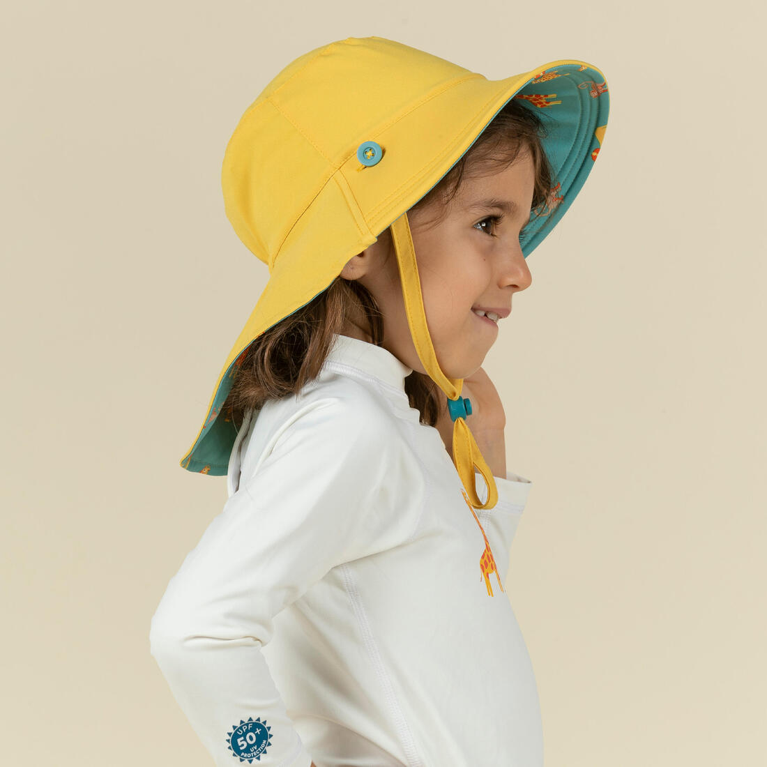 Chapeau anti uv bébé réversible jaune et bleu imprimé savane