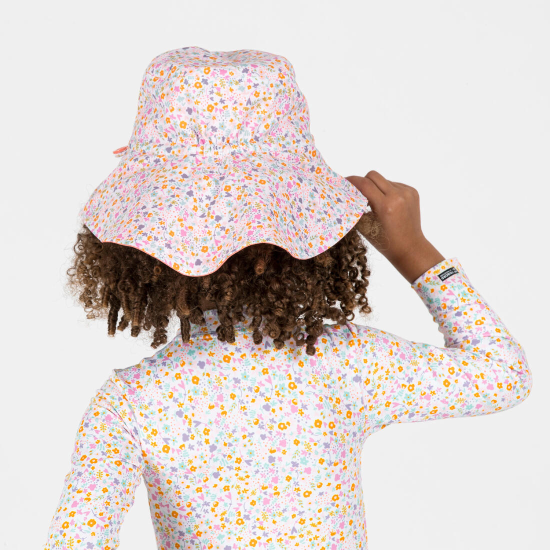 Chapeau anti uv bébé réversible rose clair et imprimé fleurs