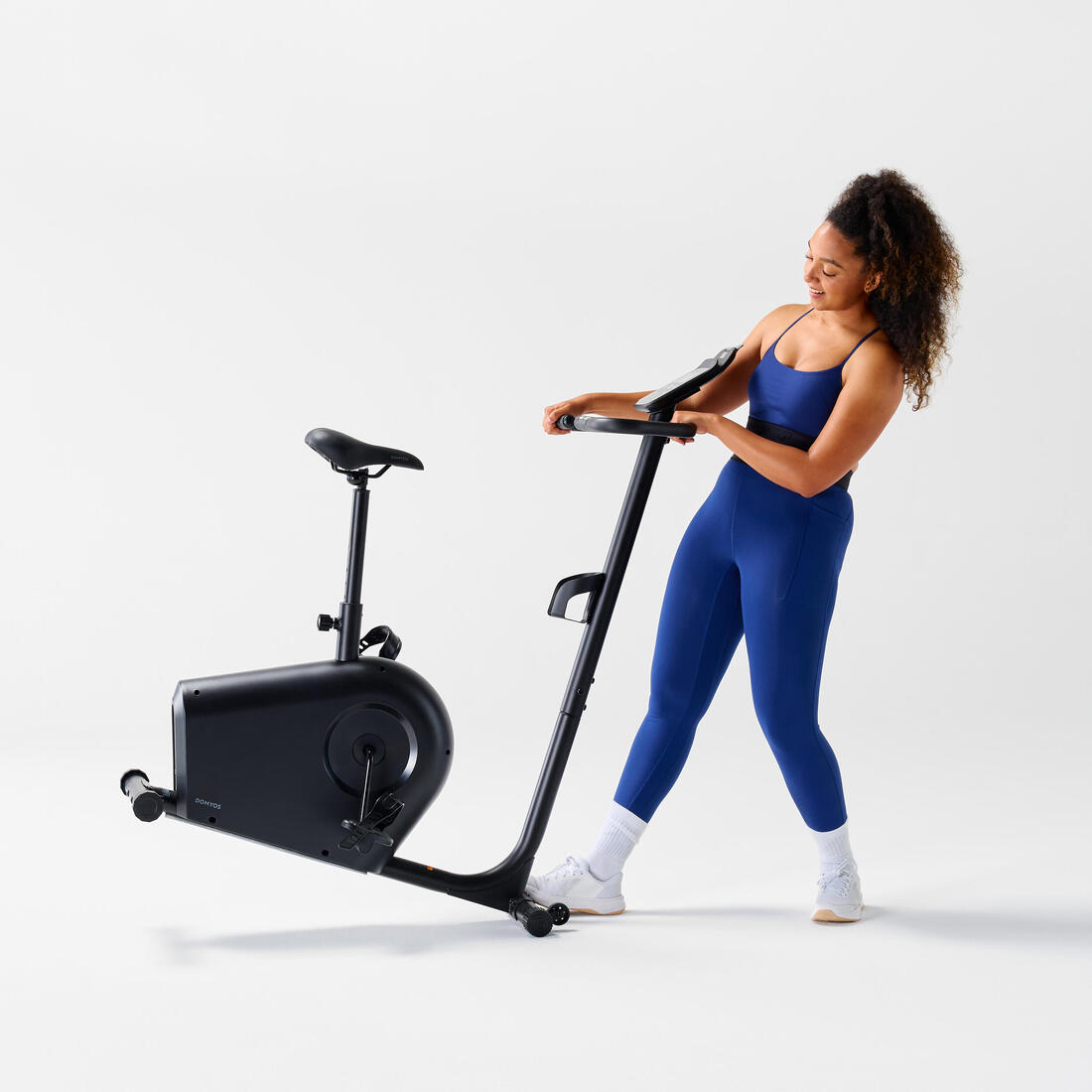 Vélo d'appartement avec résistance motorisée, EB140 B, garanti par Decathlon