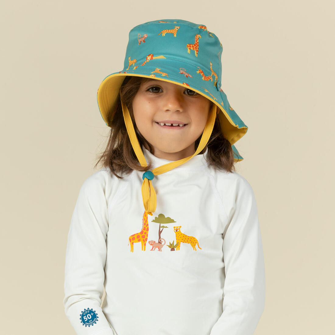 Chapeau anti uv bébé réversible jaune et bleu imprimé savane