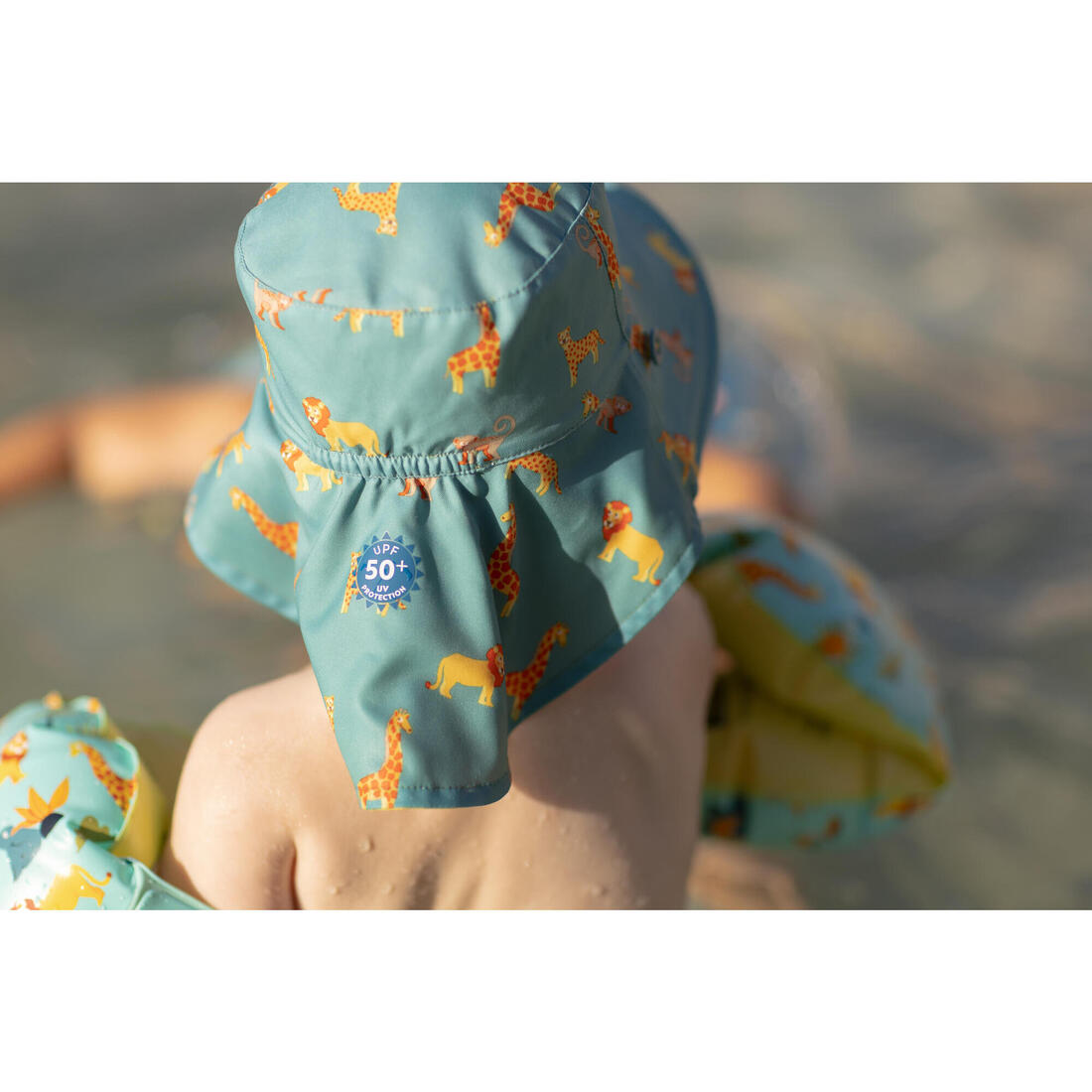 Chapeau anti uv bébé réversible jaune et bleu imprimé savane