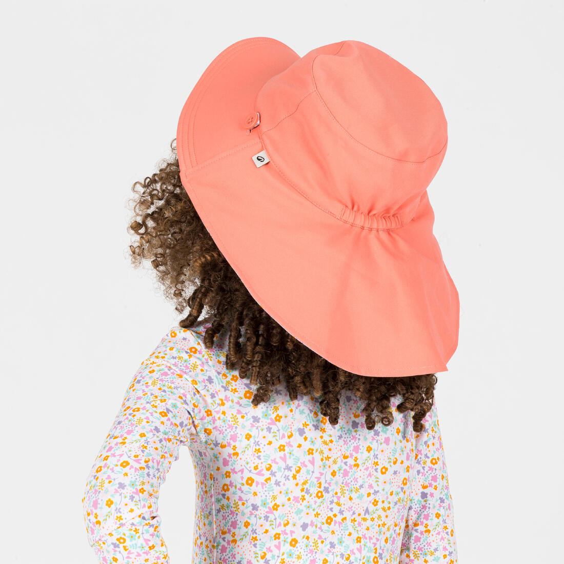 Chapeau anti uv bébé réversible rose clair et imprimé fleurs