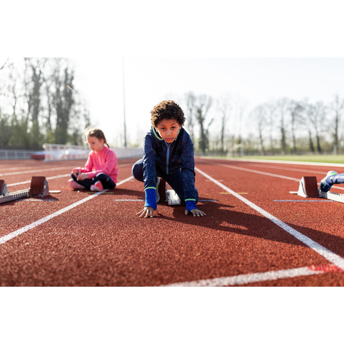 Veste coupe vent enfant pour l'athlétisme Kalenji AT 100 bleue